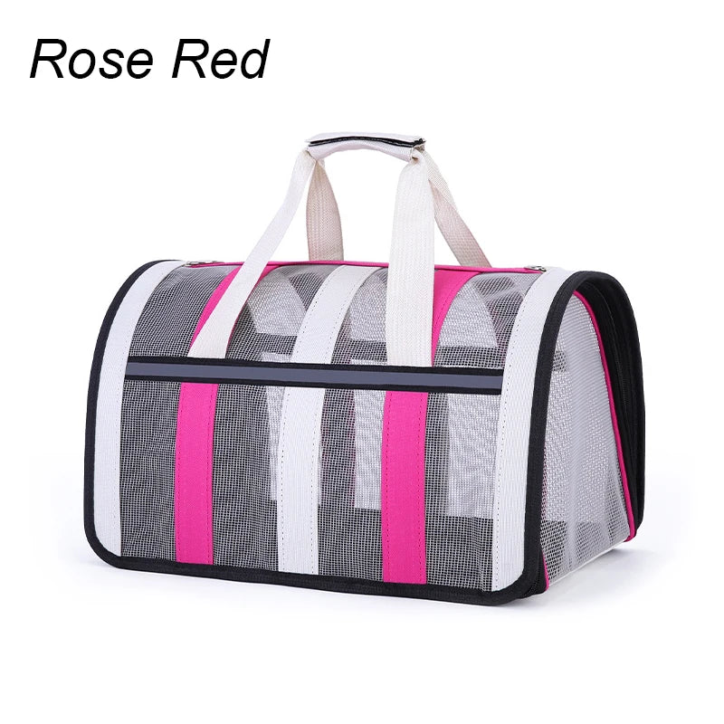 Pet carrier with mesh sides, rose red trim, and white handles on a white background.