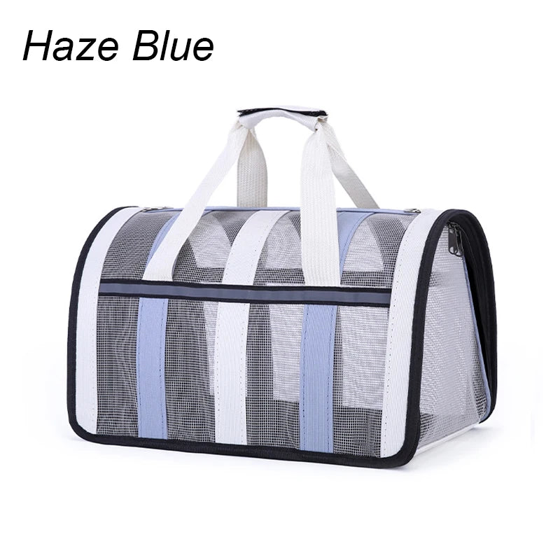 Pet carrier with mesh sides and white straps on a white background, labeled 'Haze Blue'.