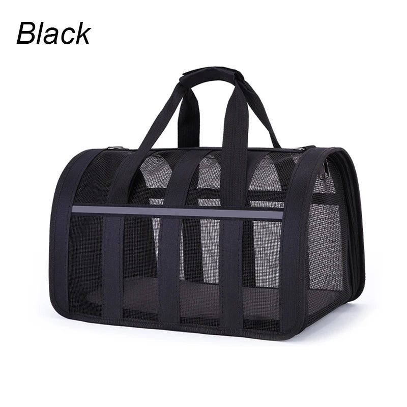 Black pet carrier with mesh sides on a white background